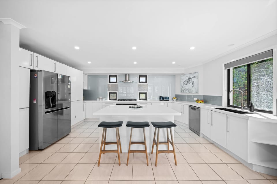 The kitchen is fully equipped and positioned to make cooking a breeze, with ocean views that make meal prep feel like a pleasure rather than a chore.