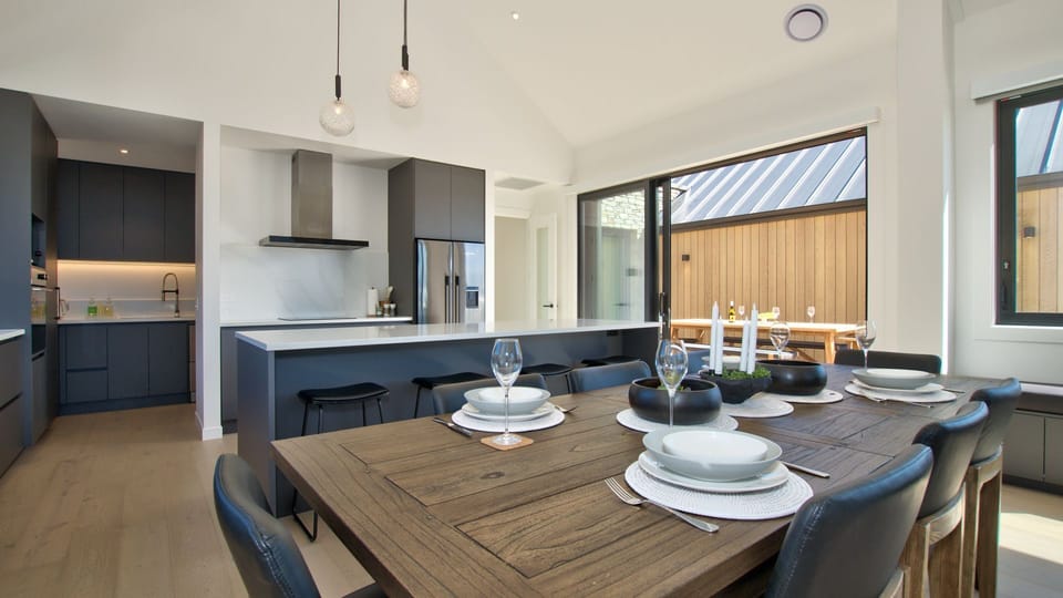 Kitchen dining area with easy access to outdoor dining table and BBQ