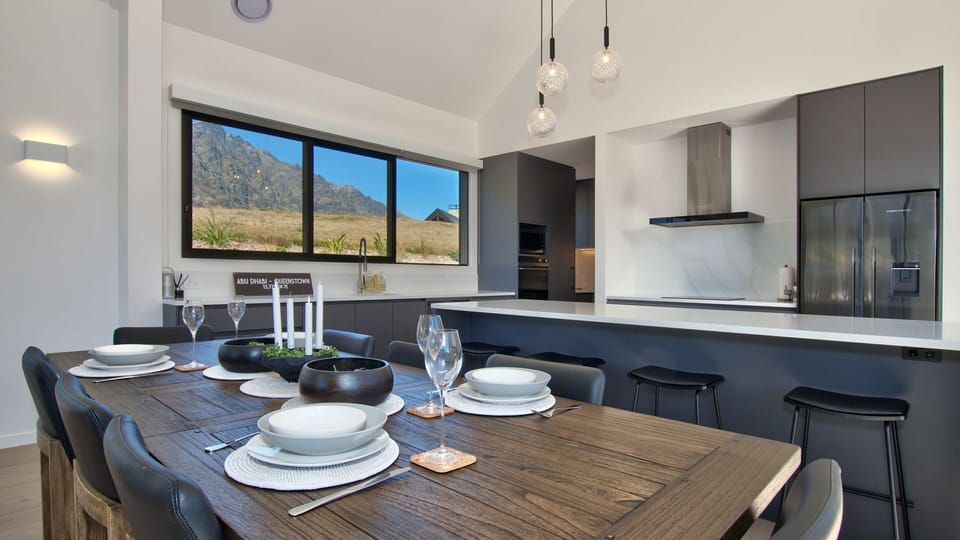Large dining table and kitchen including Butlers Pantry