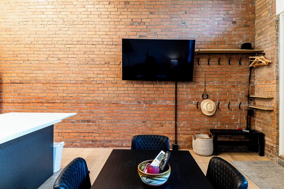 Lots of clothes storage, convenient hooks and shoe shelf at the entry.
Large LG TV