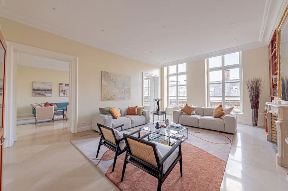 Step into the double living room, flooded with light from large windows