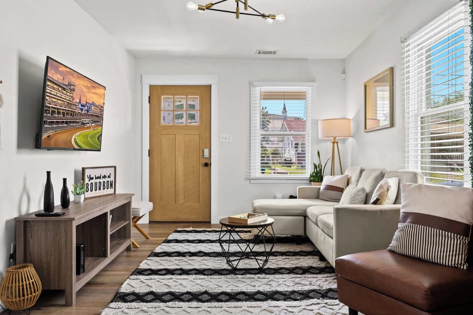 Living Room: Cozy comfort meets modern style — unwind in this bright and inviting Airbnb living room, perfect for relaxing after a day of exploring.