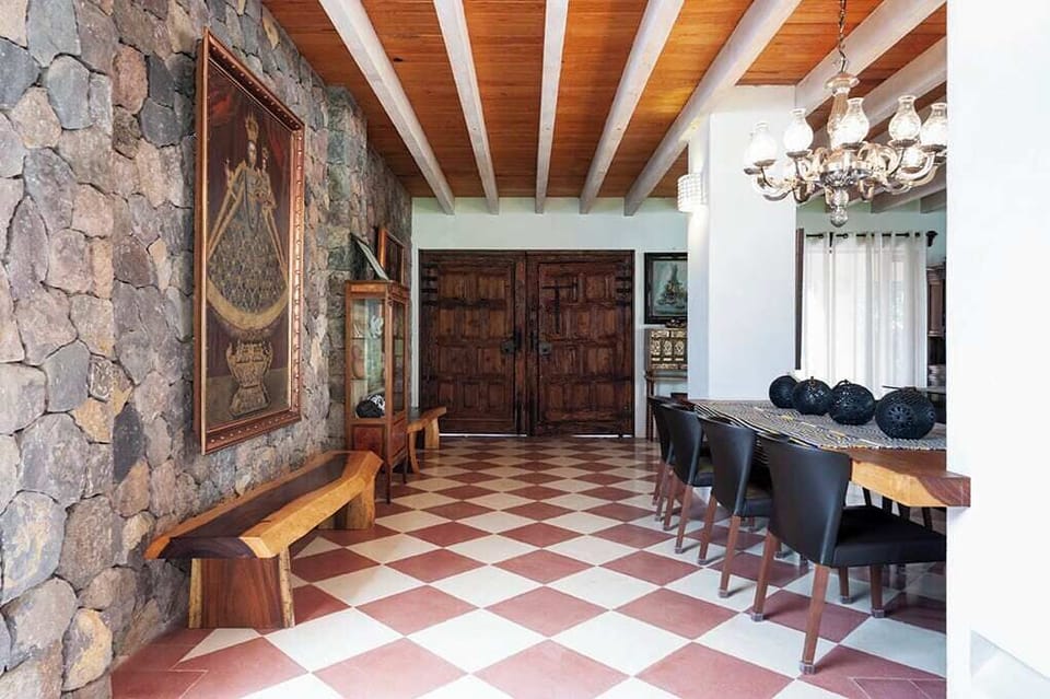 Stone walls and exposed beam ceilings throughout