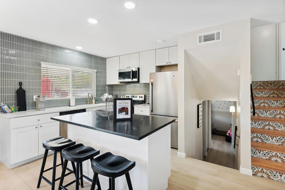 Aside from the large dining table, the bar seats up to 3 more people.