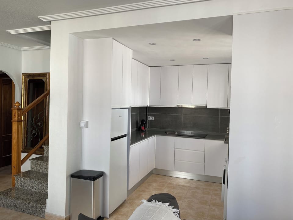 kitchen and stairs leading to master bedroom