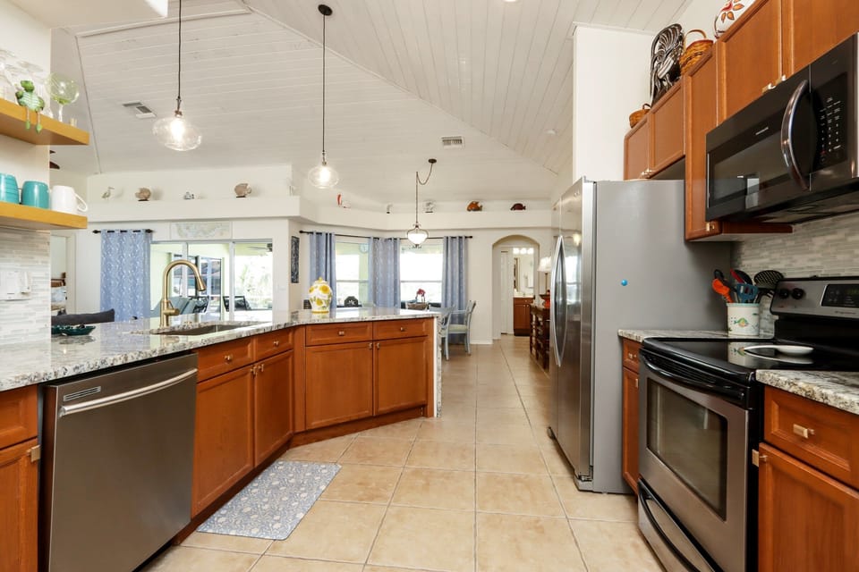 The open kitchen layout makes it easy to stay connected while prepping meals and enjoying time together
