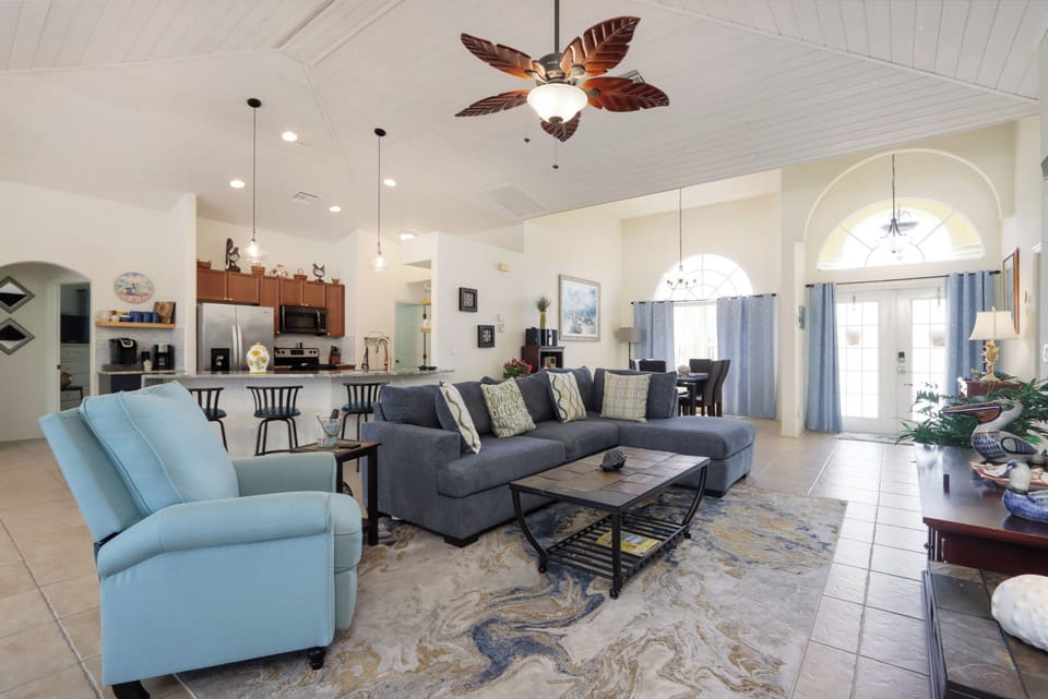 Cozy up in the living room on the spacious sectional couch—perfect for relaxing and hanging out together