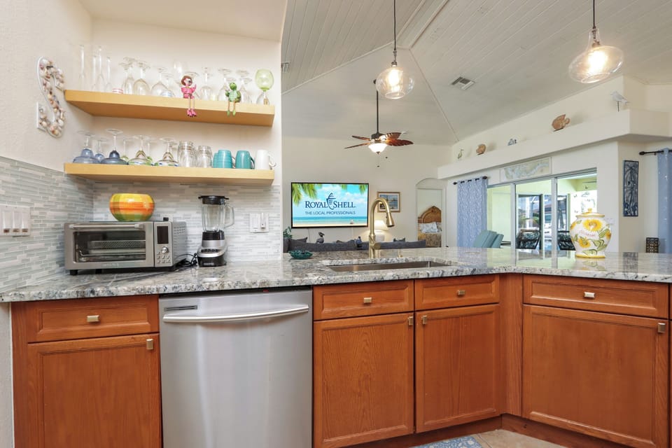 Bright and modern open kitchen with stainless steel appliances—perfect for whipping up family favorites