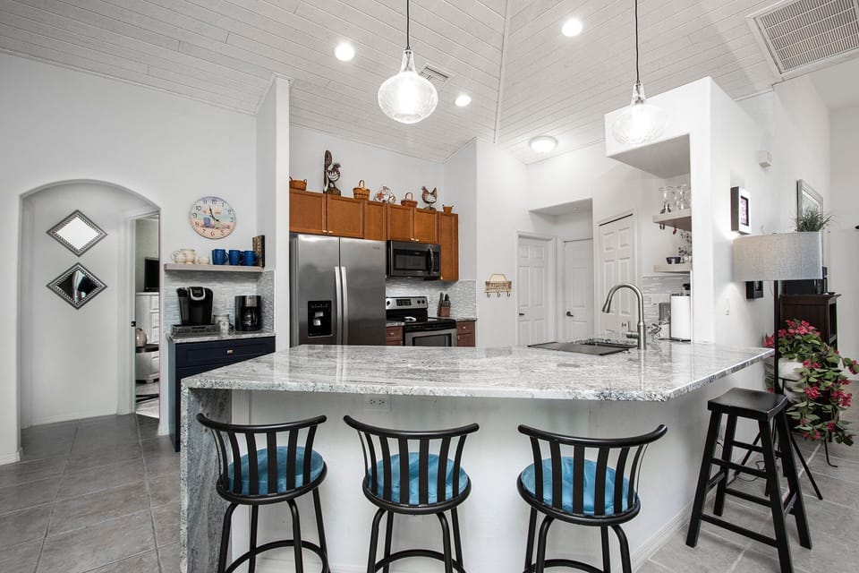 Kitchen counter with comfy bar seating, great for casual meals and hanging out with the chef