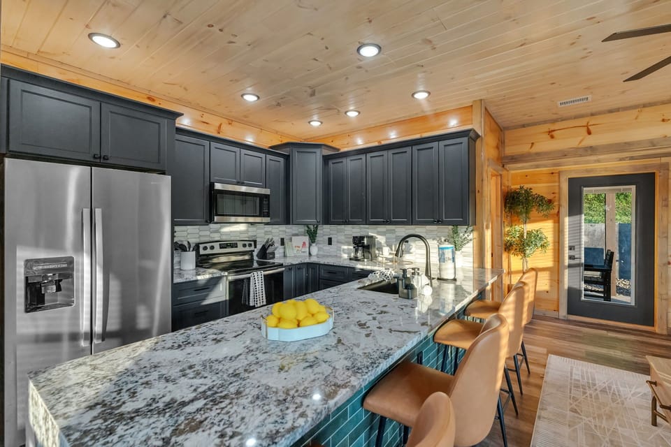 Modern kitchen with stainless steel appliances and granite counters