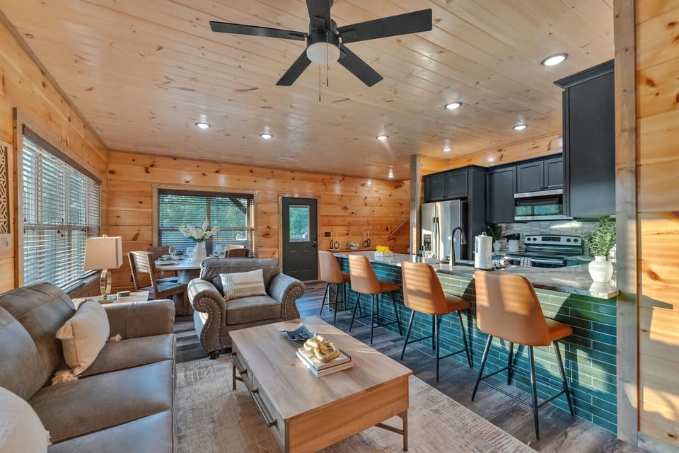 Inviting living room with cozy seating and modern mountain style.