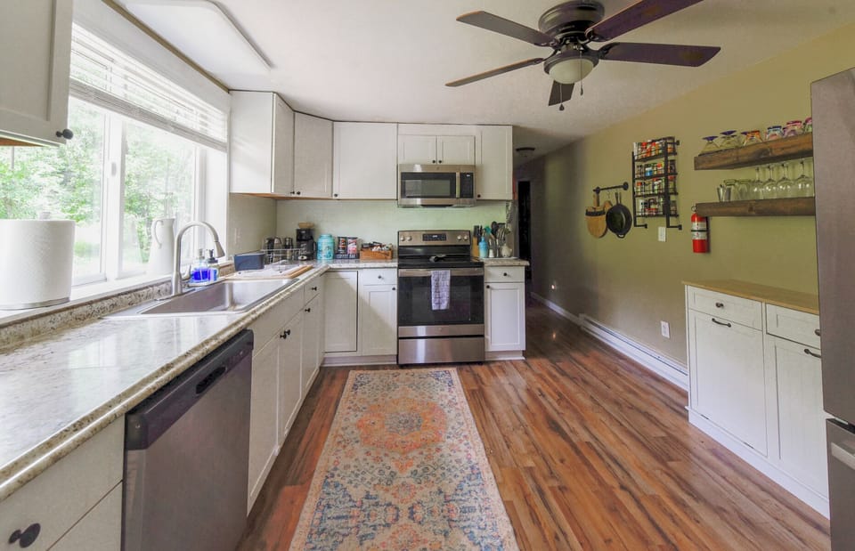 Upper level kitchen has all new appliances, dishwasher, fridge with ice maker.