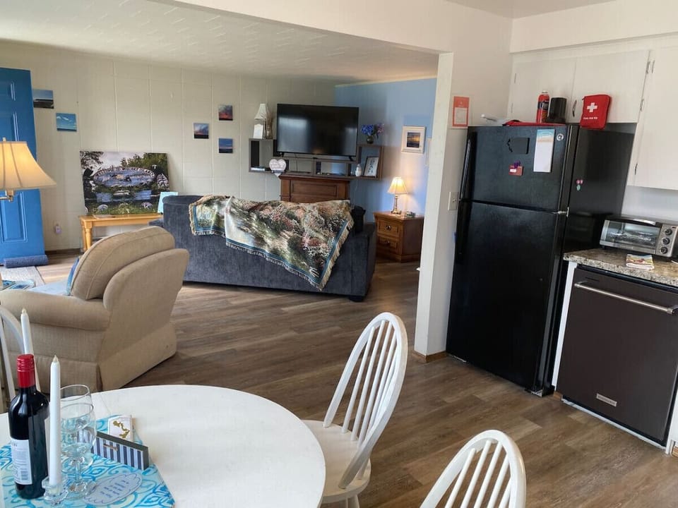 Wide open space to visit and share from the kitchen/dining area to the living room.