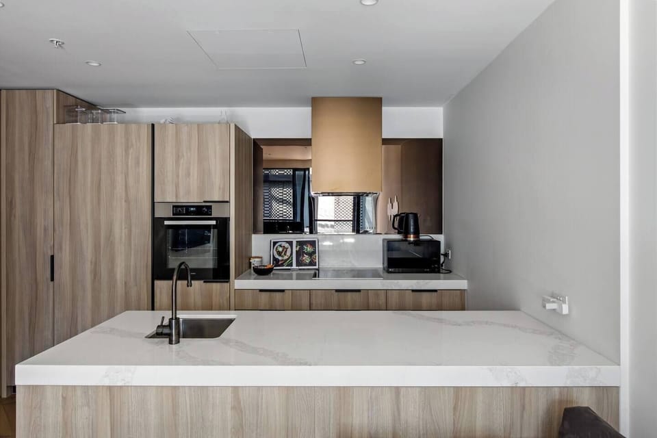 The sleek kitchen is kitted with everything you’ll need to whip up a meal at home, including high-end appliances and utensils.
 
