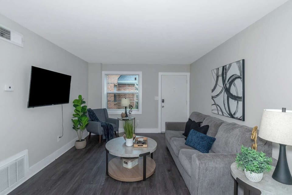 Comfortable Buckhead apartment living area with smart TV and ample seating.