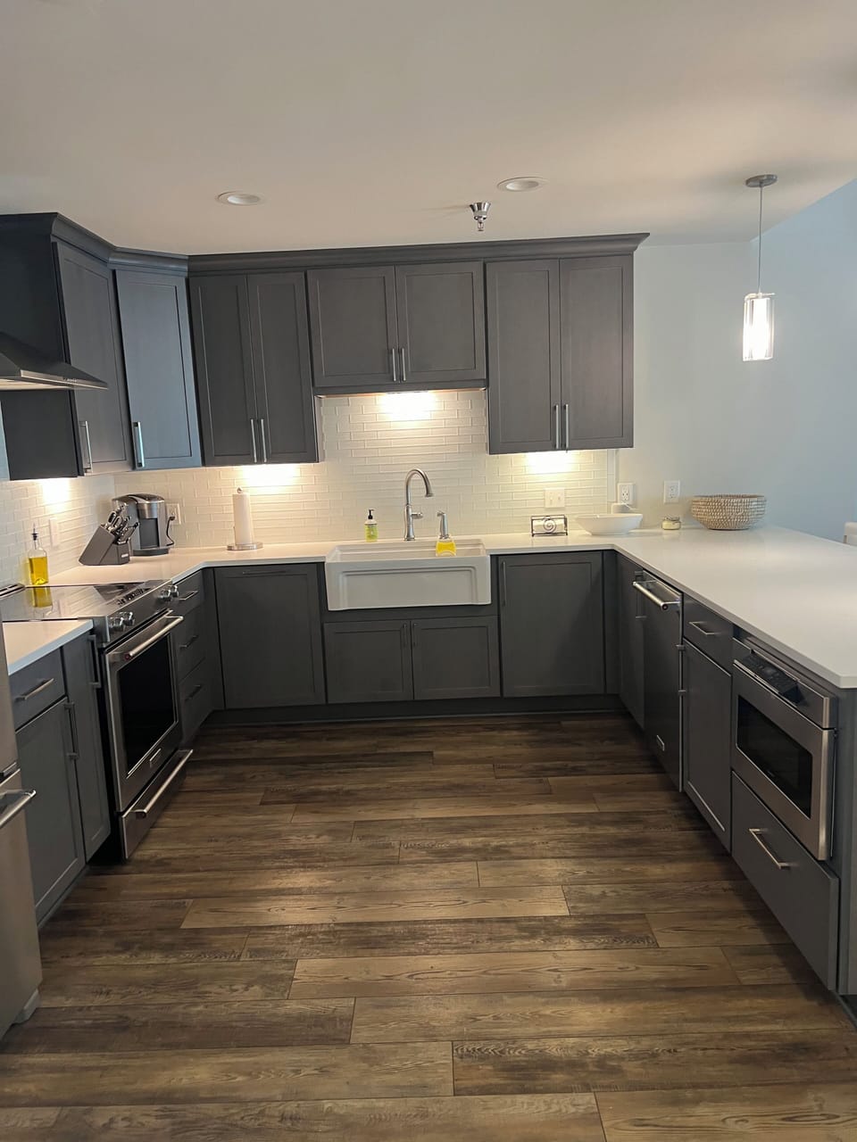 View of kitchen, dining/living/balcany all to the right.
