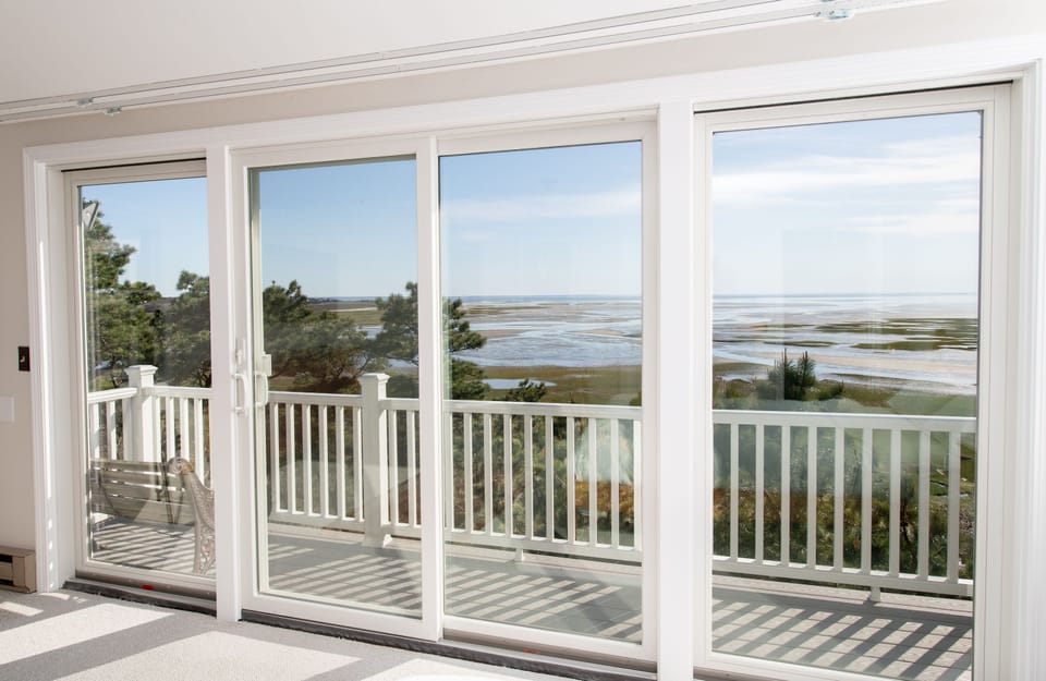 Wake up to breathtaking views of the water and greenery from the private balcony of the master bedroom.