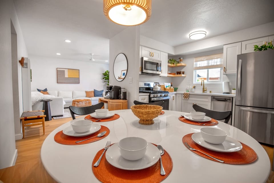 Enjoy delicious meals with your guests in this inviting dining space.