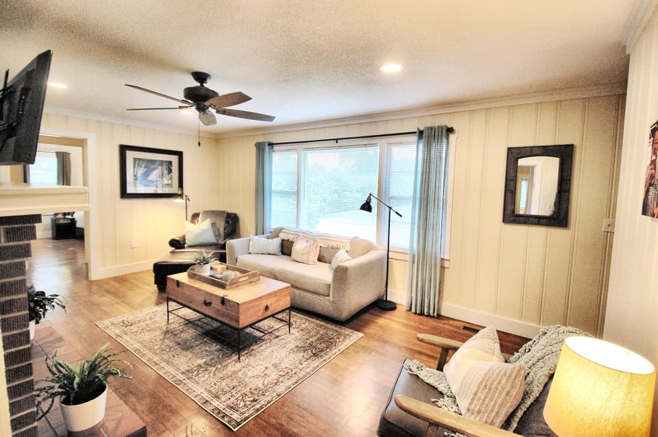 Living room, plenty of cozy seating and large windows