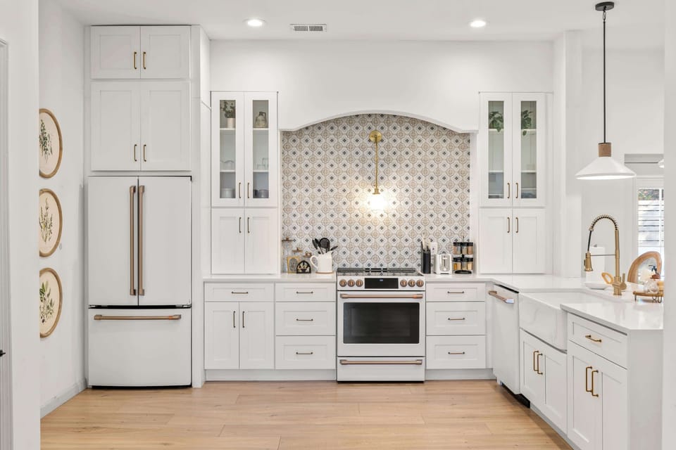 The elegant kitchen offers ample space & all the comforts of home