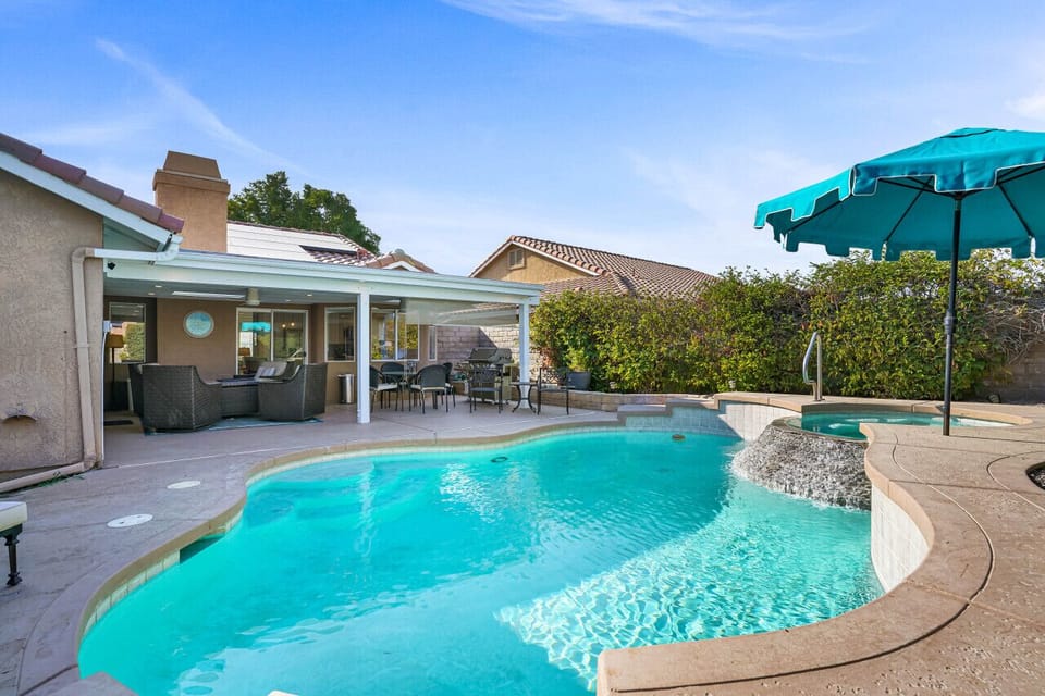 Beautiful backyard with pool, hot tub, and patio