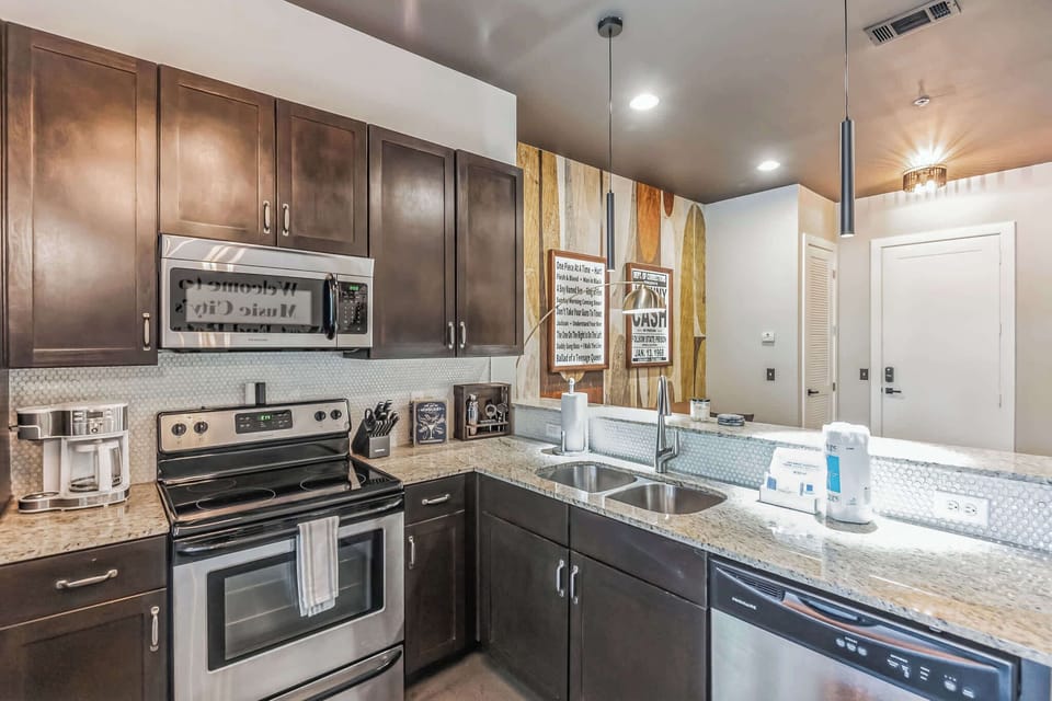 The chic, updated kitchen offers ample space & all the comforts of home