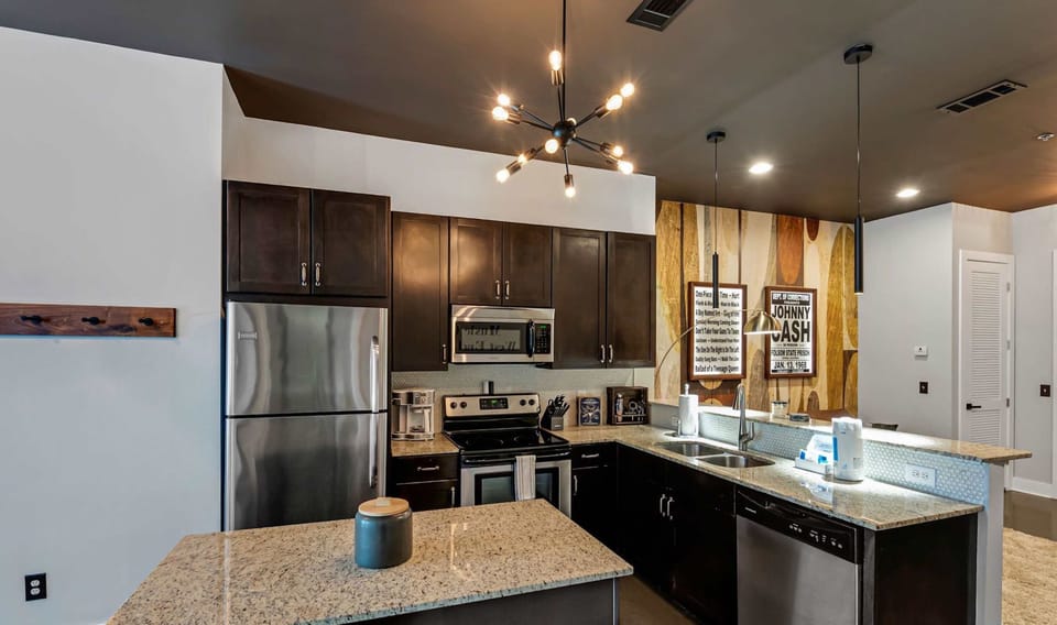 The chic, updated kitchen offers ample space & all the comforts of home