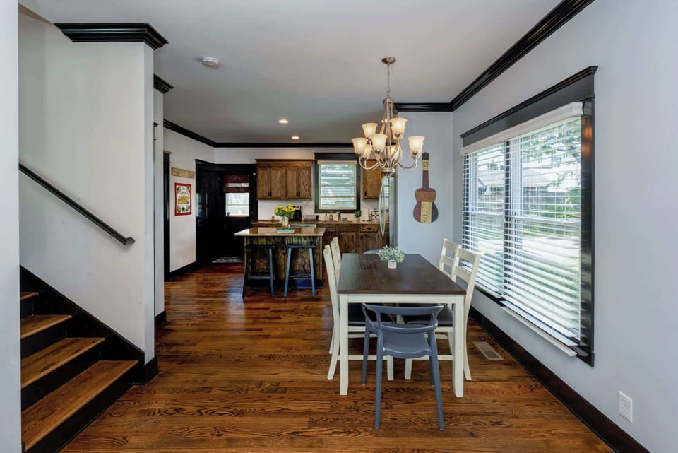 The open Dining Room Table offers seating for 6, with additional Counter Seating for 2 in the Kitchen