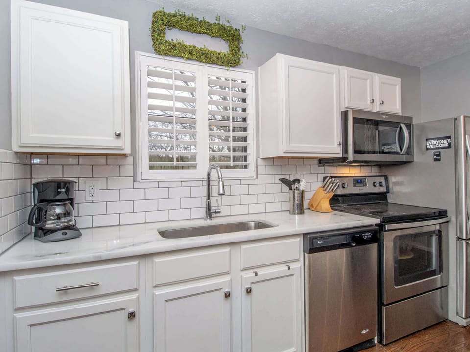 Full kitchen with stainless steel appliances