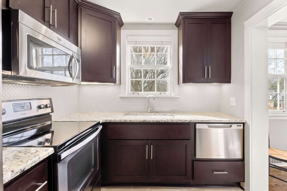 Full kitchen with dishwasher, blender, and standard drip coffee maker