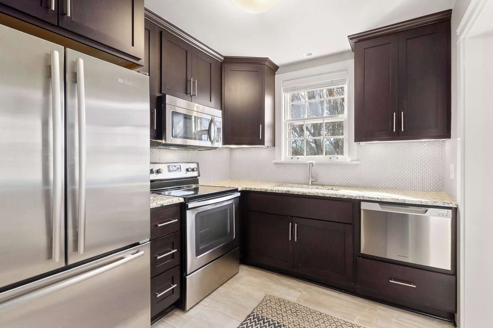 Full kitchen with dishwasher, blender, and standard drip coffee maker