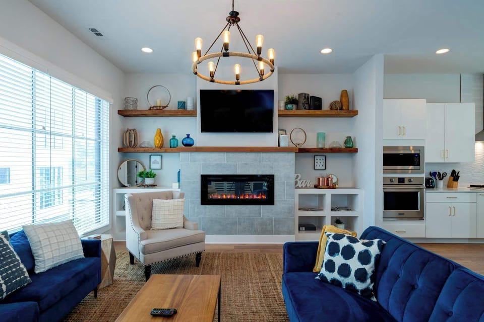 Living room with modern decor, Smart TV and 2 queen sofa sleepers