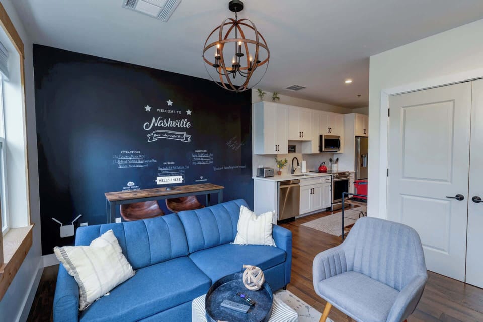 The airy living room offers a comfy full sleeper sofa and dining seating for 2