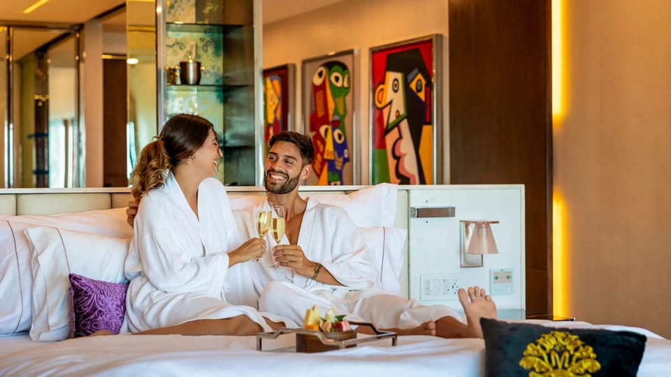 Romantic luxury suite at Hotel Mousai Cancun with plush bedding and in-room