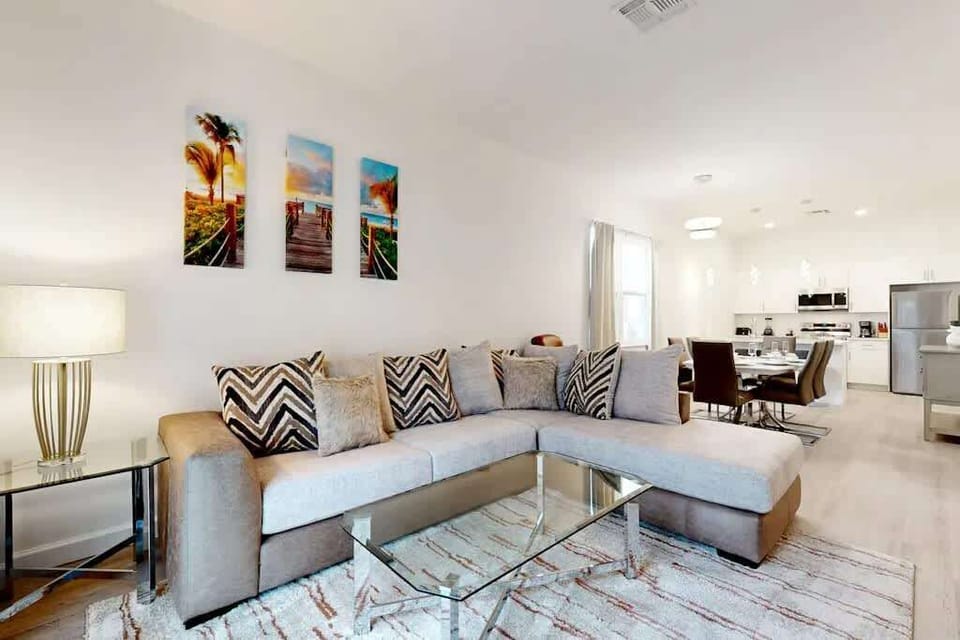 Unwind in the spacious living room with cozy seating and a Smart TV for your entertainment.