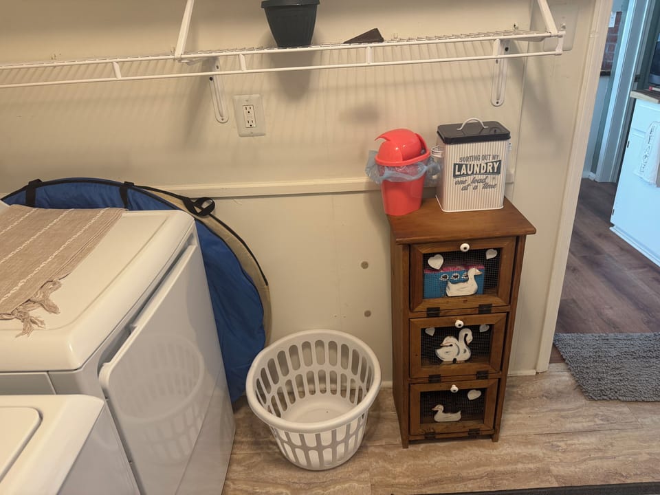 Laundry room! The round things by the dryer/portable pop-up screen rooms for two