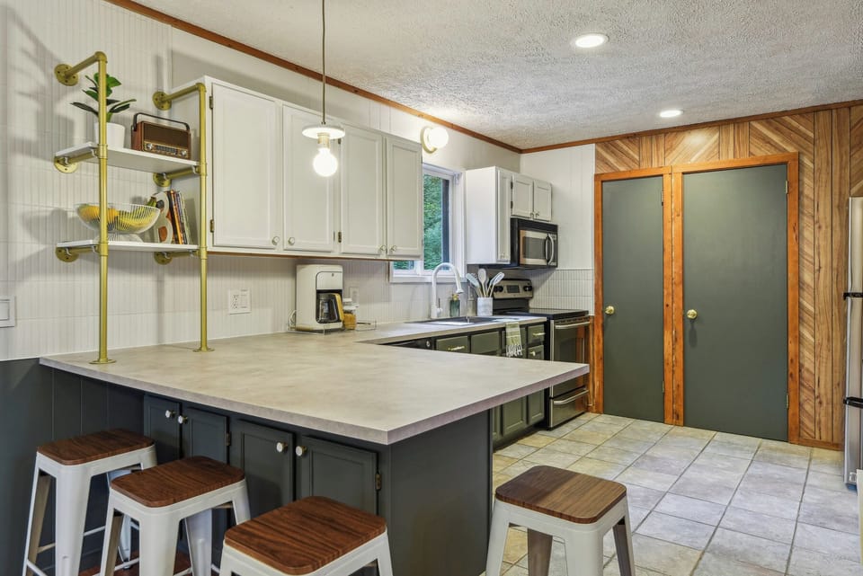 We recently refreshed this kitchen with new paint, countertops and hardware.