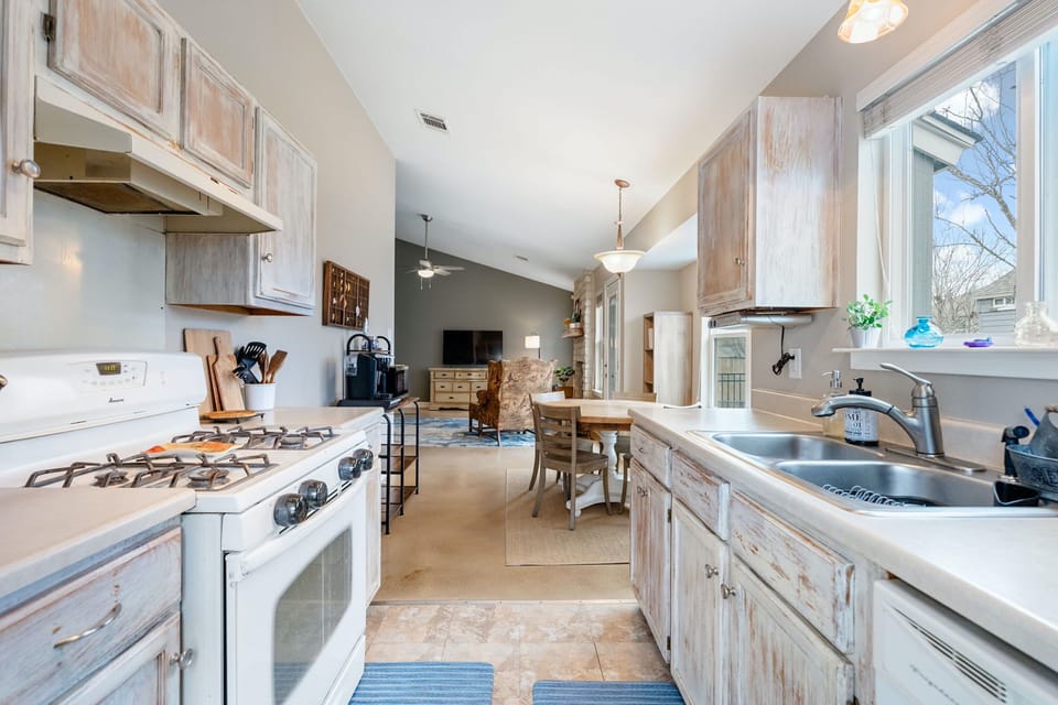 The tranquil kitchen offers ample space & all the comforts of home