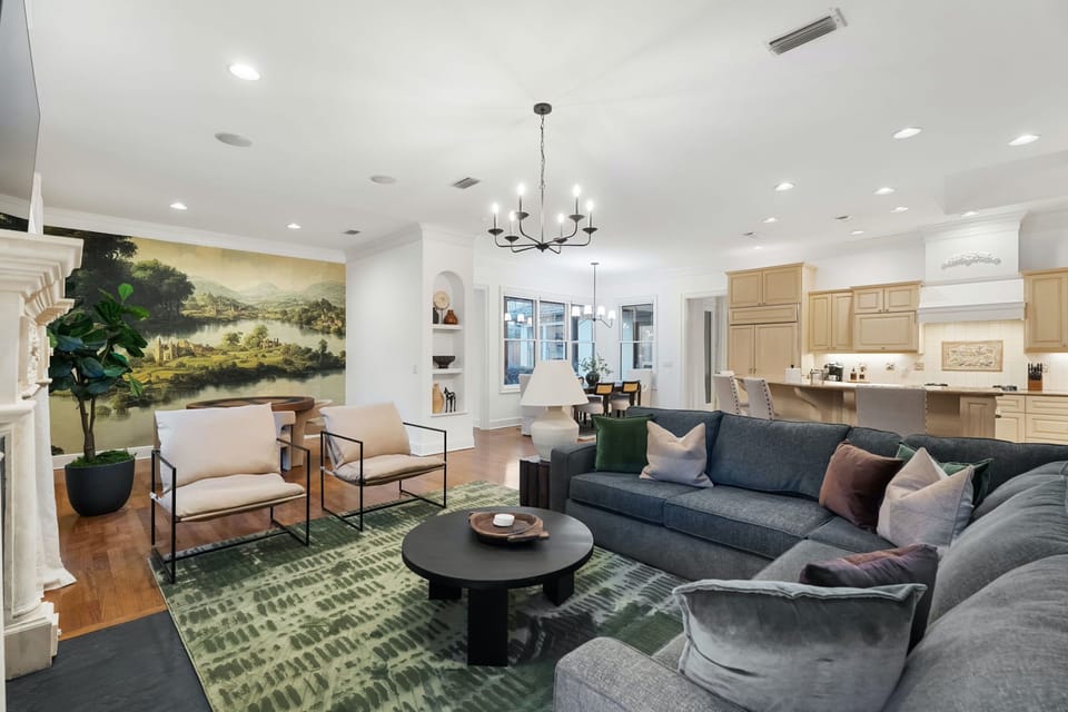 Open living space with sofa sleeper, Smart TV, and gas fireplace