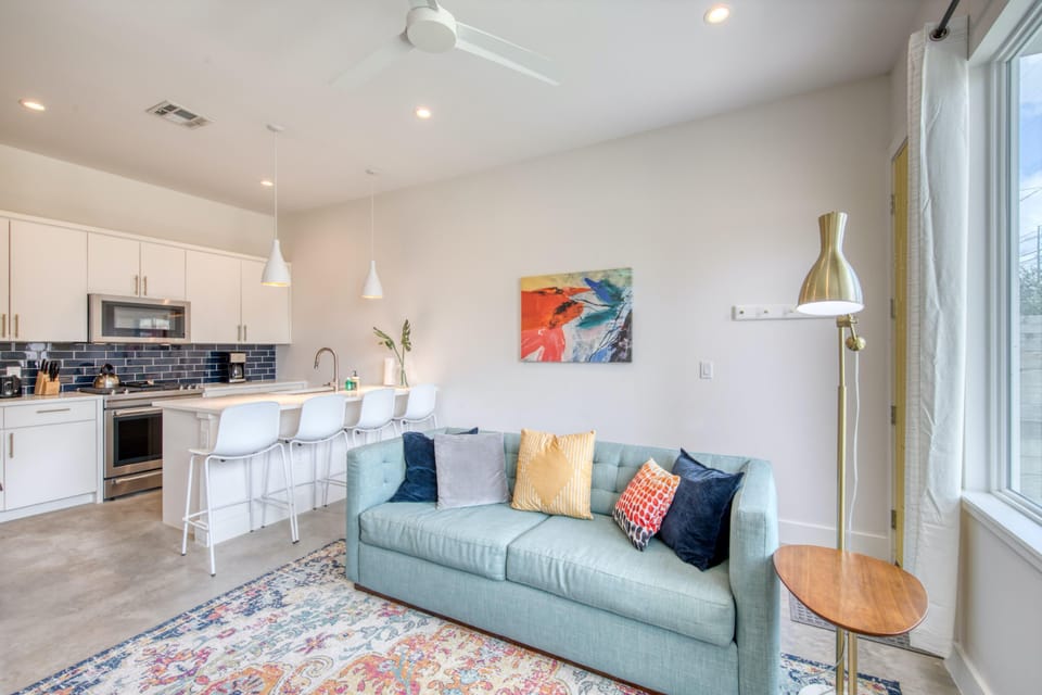 Unit B Living room with couch and flat screen TV