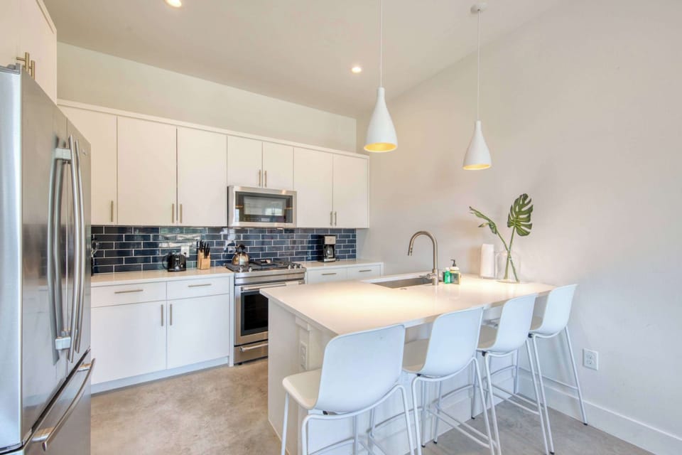 Kitchen with drip coffee maker, toaster, blender, and more
