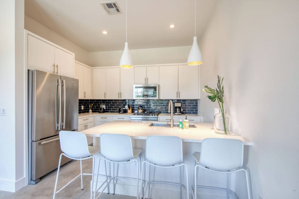Kitchen with drip coffee maker, toaster, blender, and more