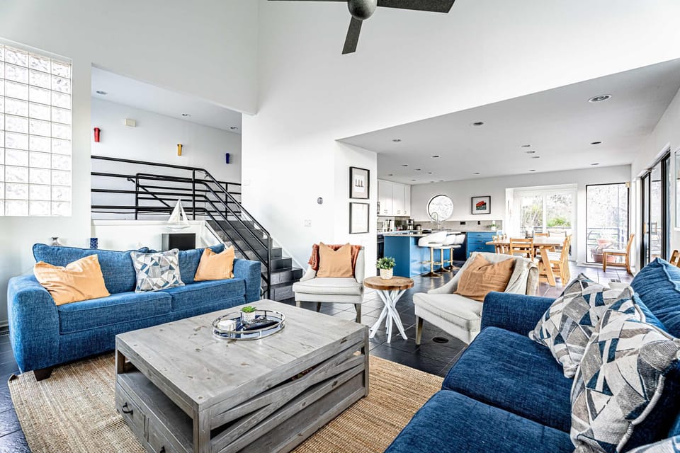 Modern spacious living area with TV and fireplace