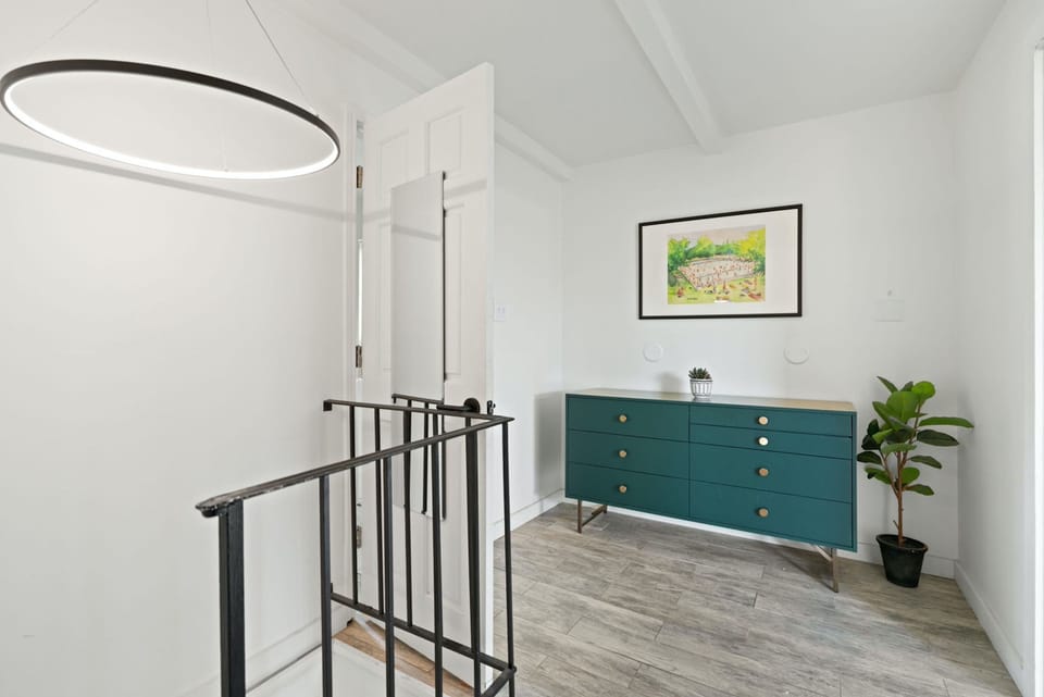 The second level showcases the primary king suite, with deck access