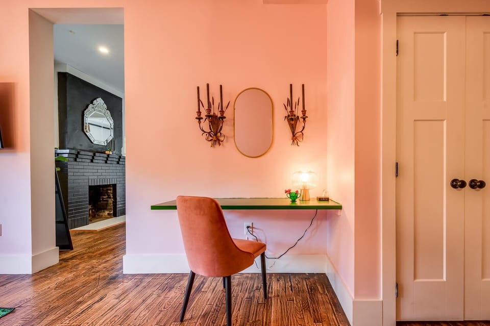 Suite 103 – The Accessible 1st Floor Chandelier Canopy Suite offers a King and Queen Casper Bed, Smart TV, and private Bathroom