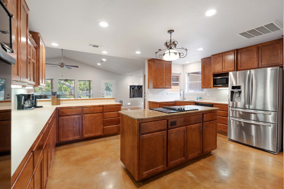 The main house kitchen is spacious and open, with all the comforts of home
