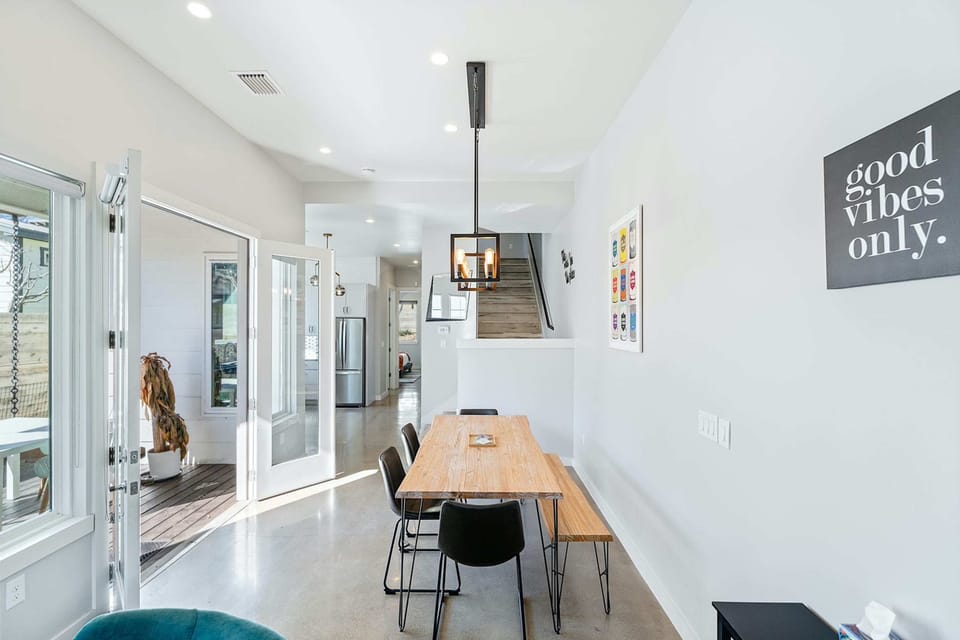 Gather for elegant meals together at the dining table, with space for 7
