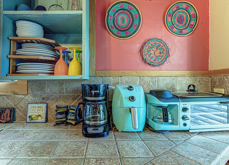 The charming kitchen area offers ample space & all the comforts of home