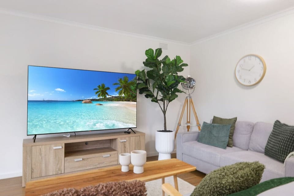 Downstairs lounge with smart tv and reverse cycle heating and cooling