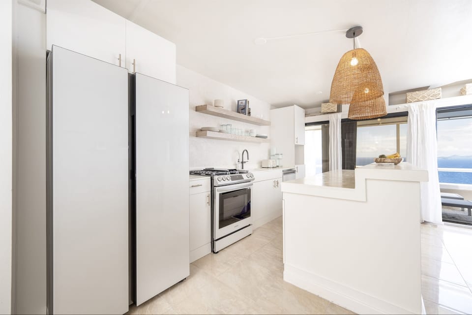 A kitchen where style meets function—modern, clean, and fully stocked.